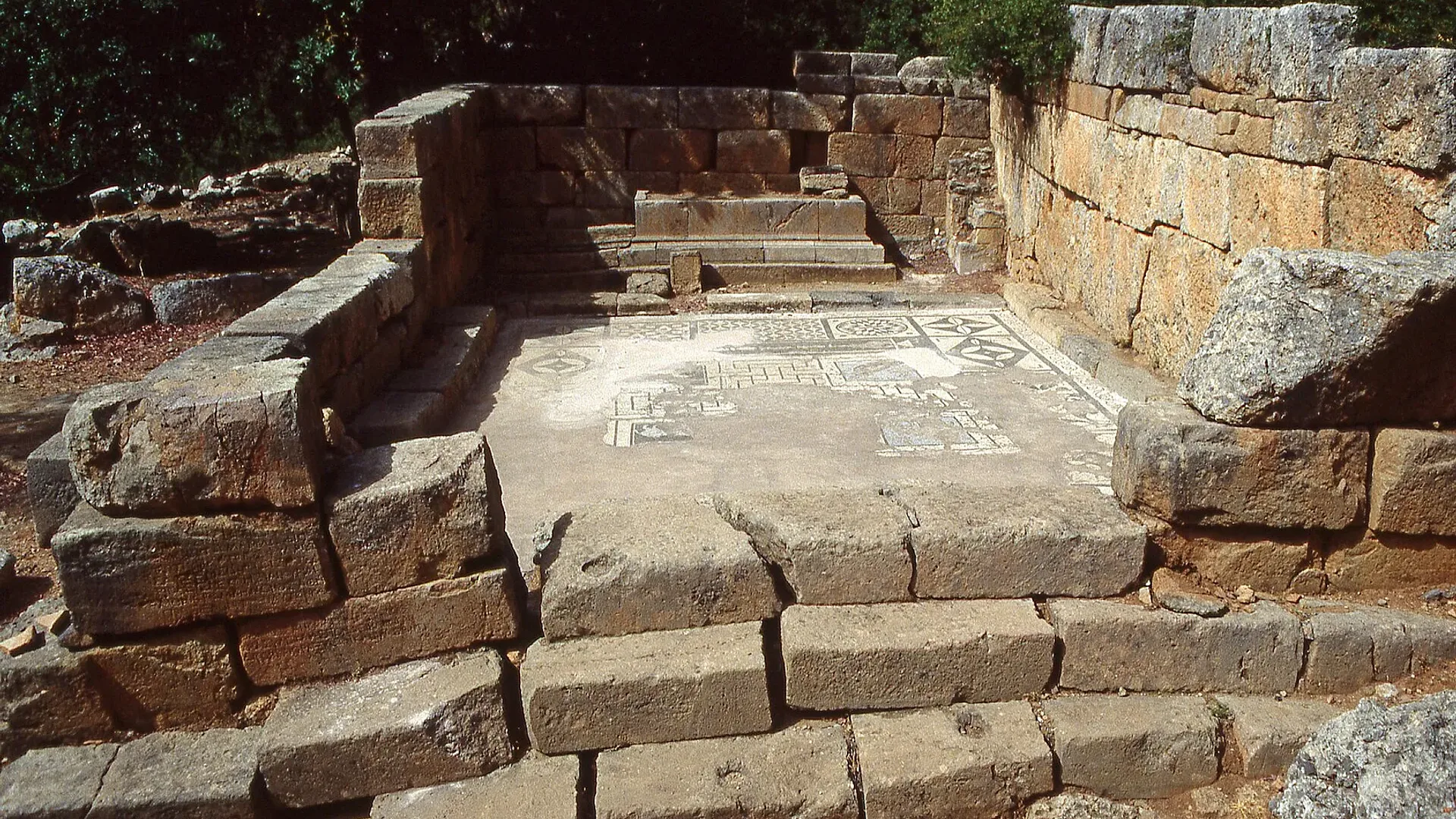Stone walls and the mosaic floor of the Asklepieion healing sanctuary in Lissos